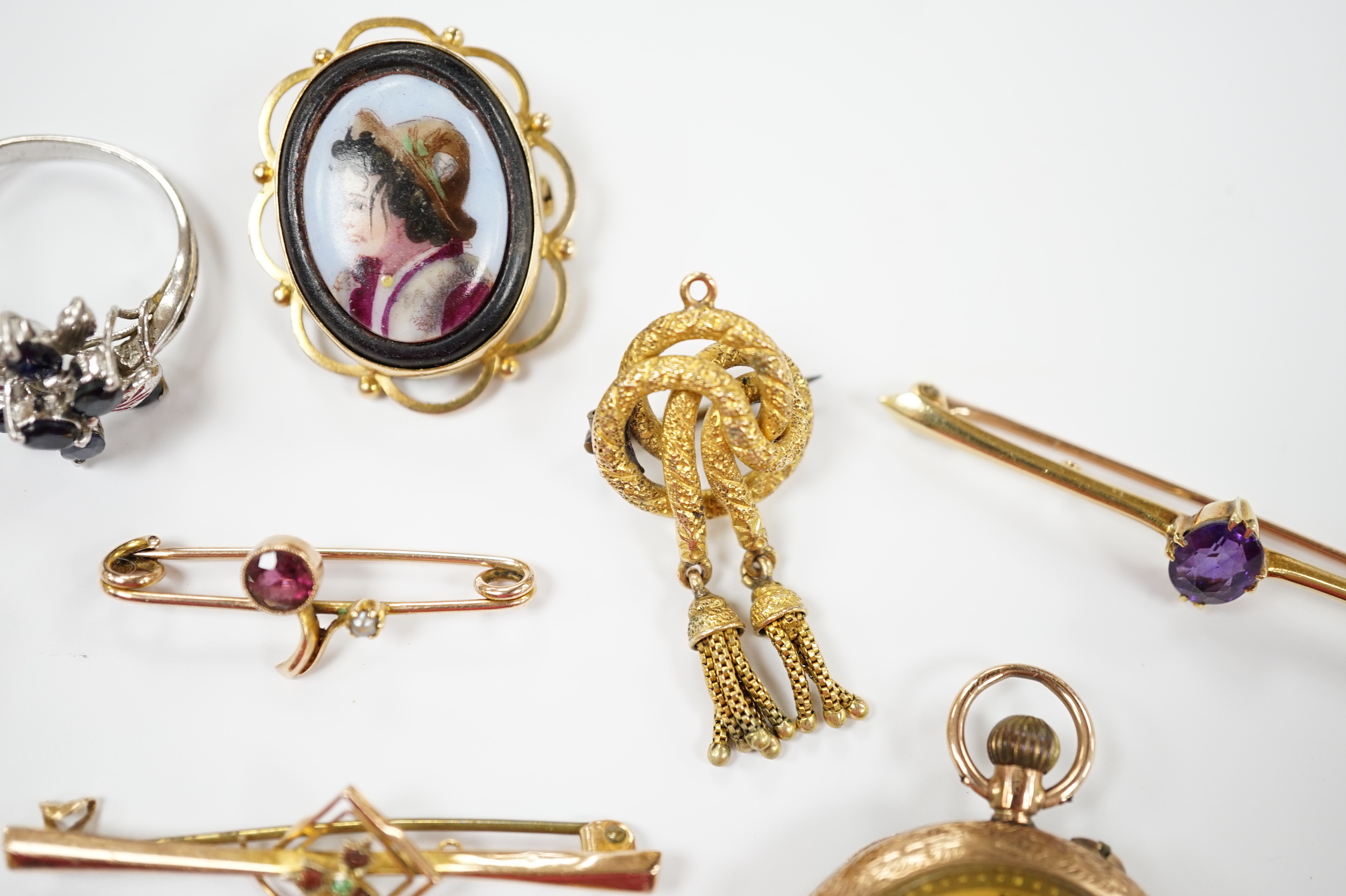 A group of assorted jewellery including a 15ct and single stone amethyst bar brooch, three other yellow metal and gem set bar brooches including two 9ct, a 9ct and enamel brooch, an 18ct watch, a 9ct fob watch and two ot